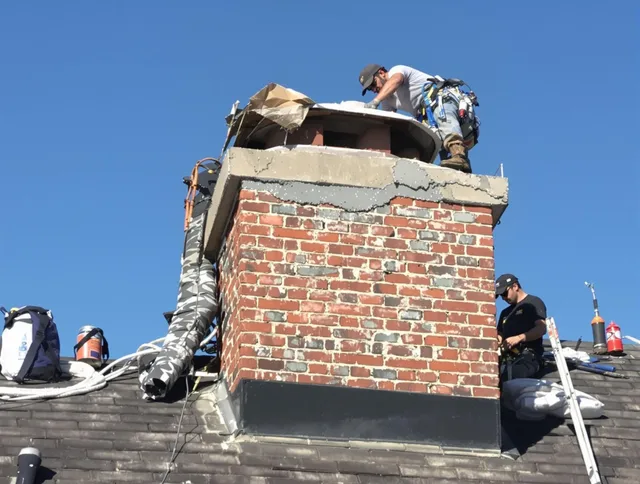 Middletown Chimney Sweep installing a custom chimney crown in Middletown, CT
