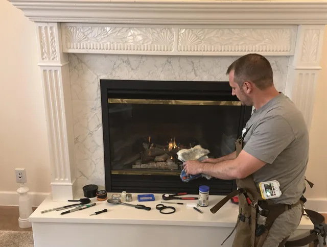 Middletown Chimney Sweep performing fireplace maintenance in Middletown, CT