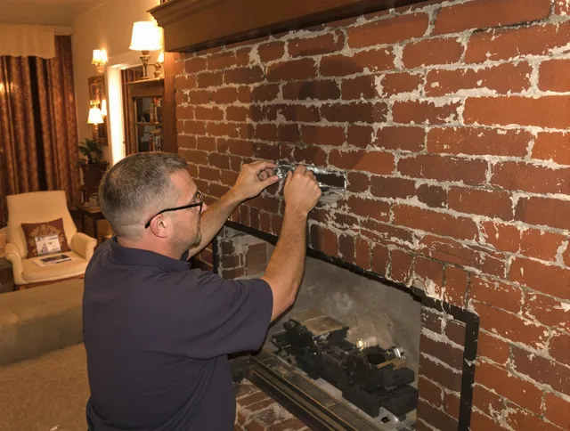 Middletown Chimney Sweep expert fixing a fireplace in Middletown, CT